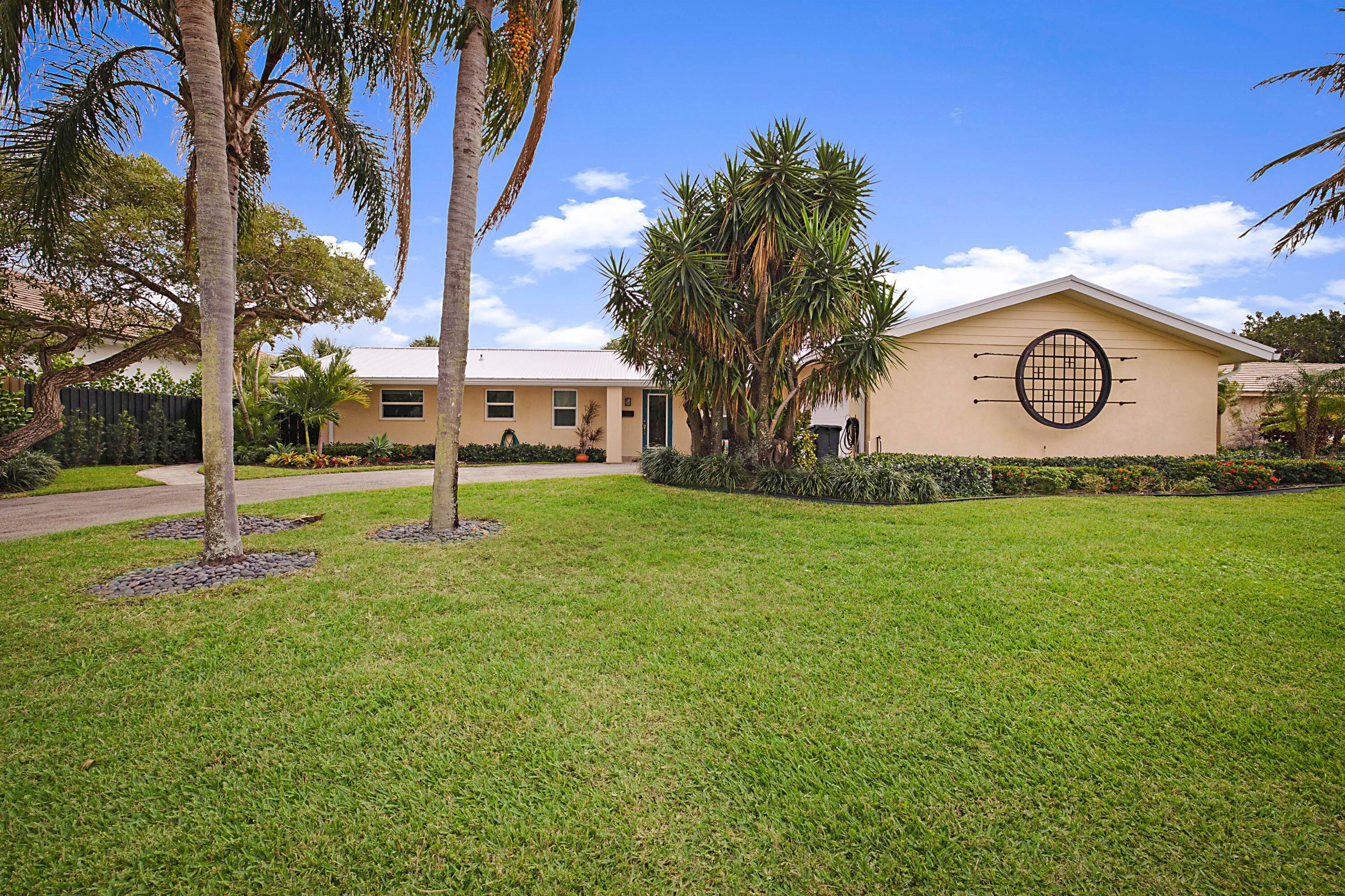 Come see this Mid Century modern three bedroom, three bath, pool home in the much sought after Yacht Club Village, North Palm Beach.