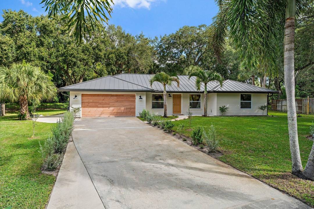 LAND and a FULLY RENOVATED home on Prime lot in the heart of Palm Beach Gardens !
