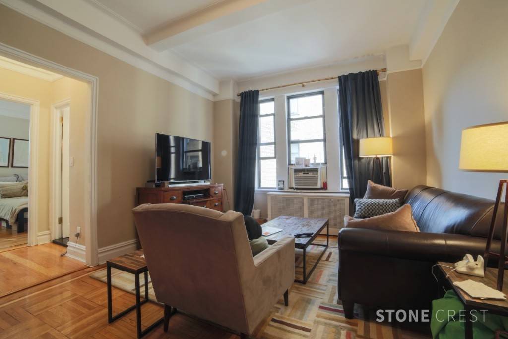 Large corner 1 bedroom apartment on the 7th floor in a classic pre war 24HR doorman elevator building with gym.