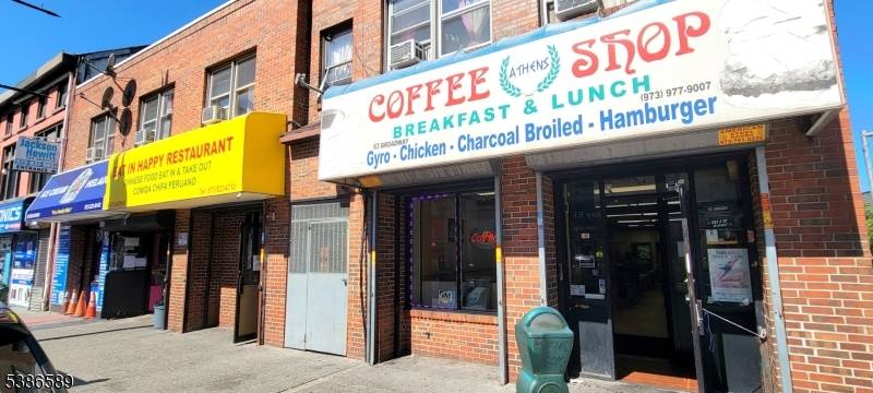 Rare find mixed use building with 3 store fronts on street level and 3 2BRs apartments on 2nd floor.