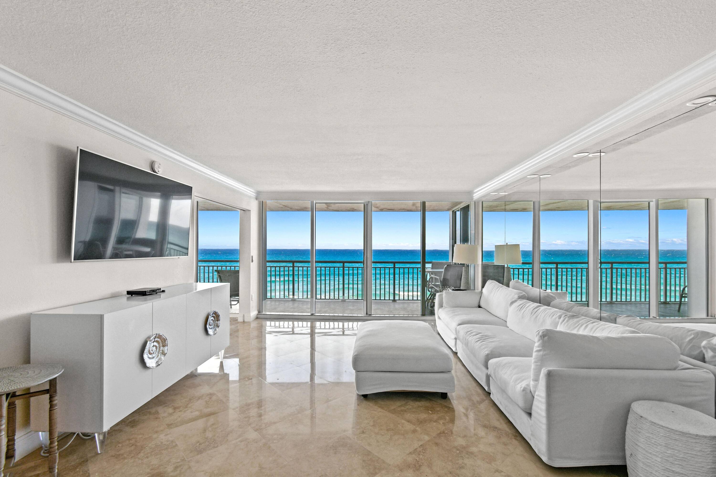 This gorgeous 2 bed 2 bath condo offers direct oceanfront views in the full service Barclay building.
