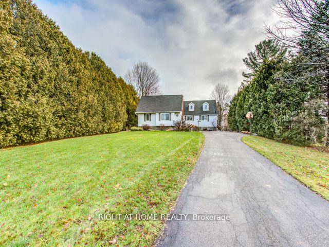 Unique And Charming Home Sitting On a Private 1.