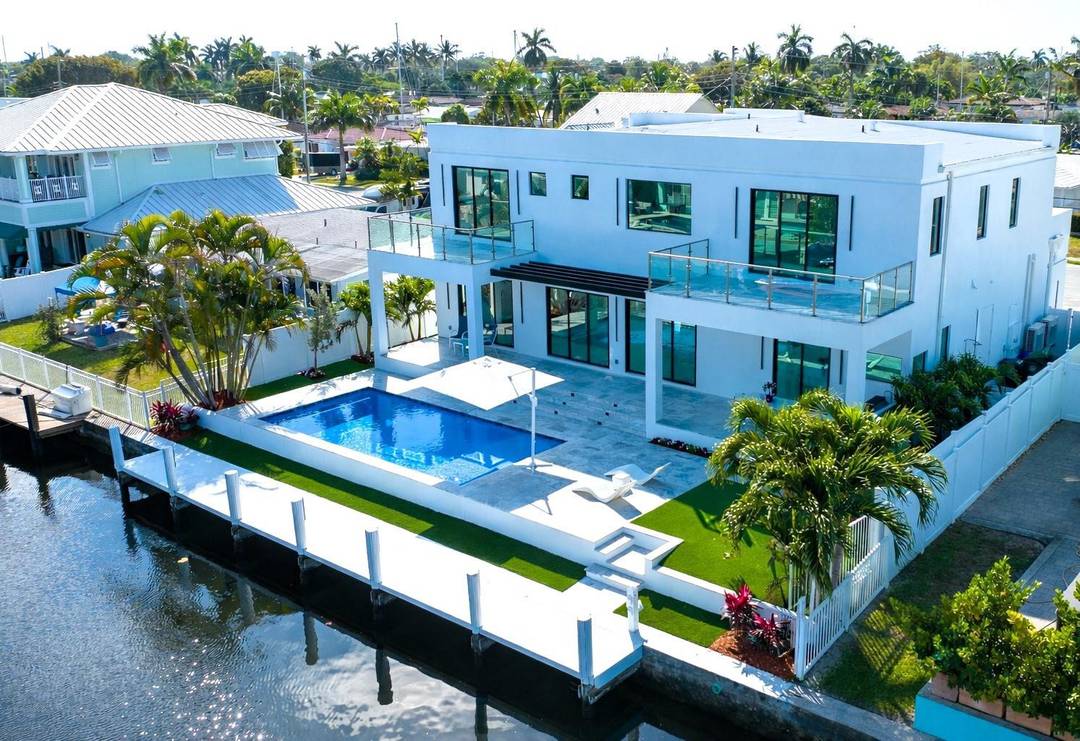 This spectacular never lived in and completed in 2026 new construction 75 ft water frontage home is designed for elegant coastal living.