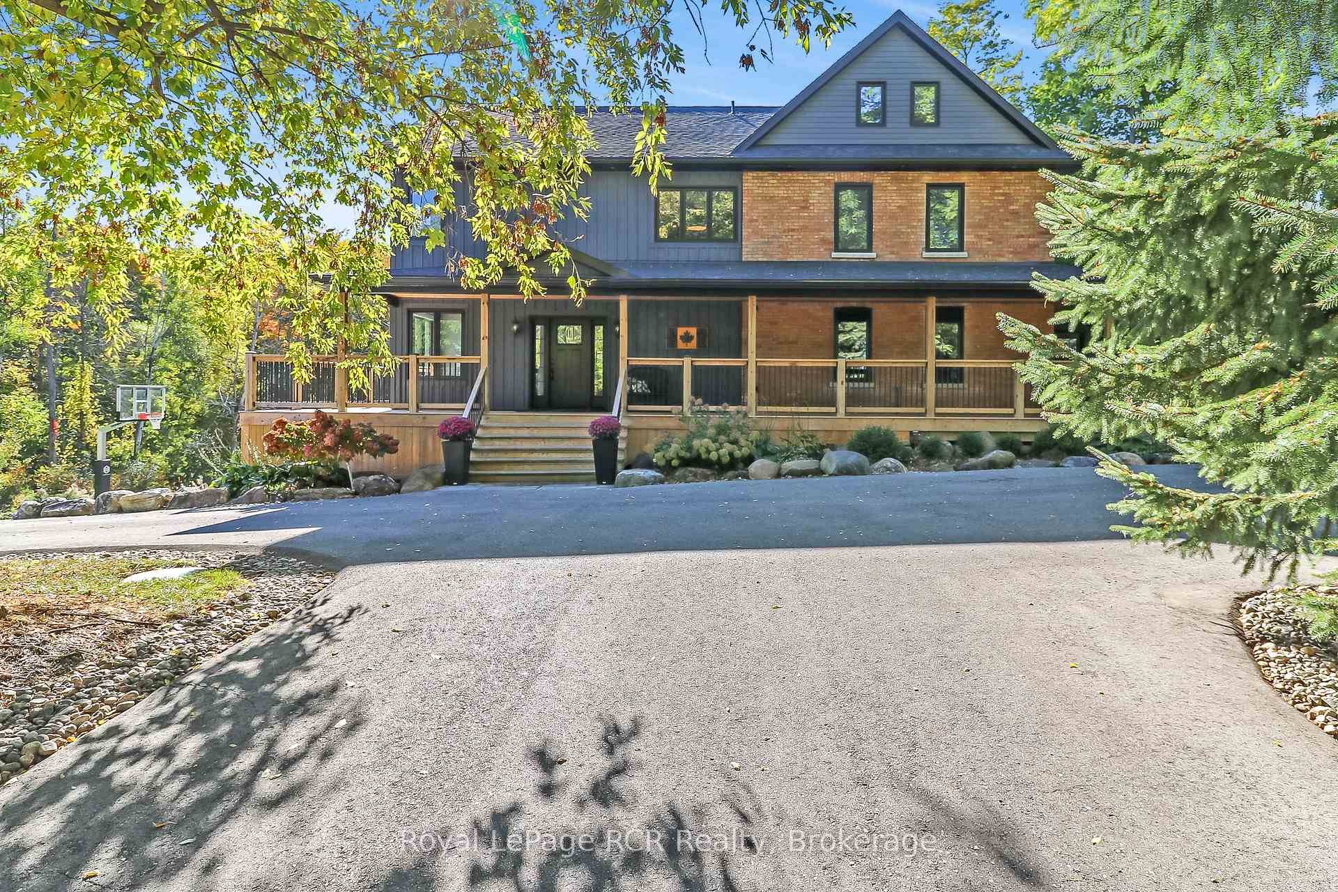 Nestled on a picturesque 3 4 acre, this stunning brick farmhouse style home offers the perfect blend of modern elegance and rustic charm.