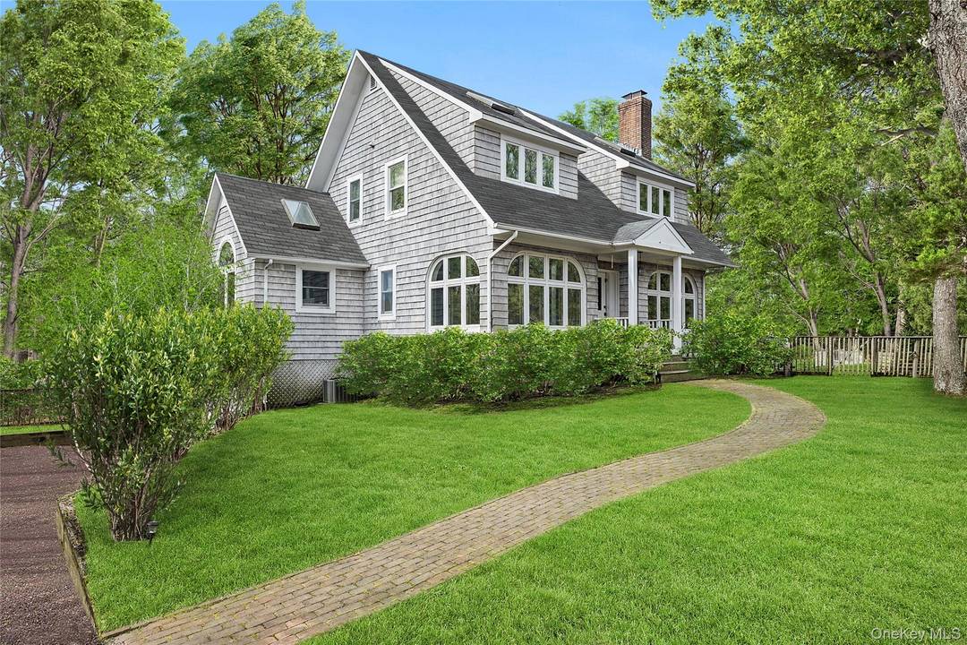 Nestled on the coveted fringe of East Hampton Village, this timeless cedar shake Hamptons home offers refined year round living with modern comforts.