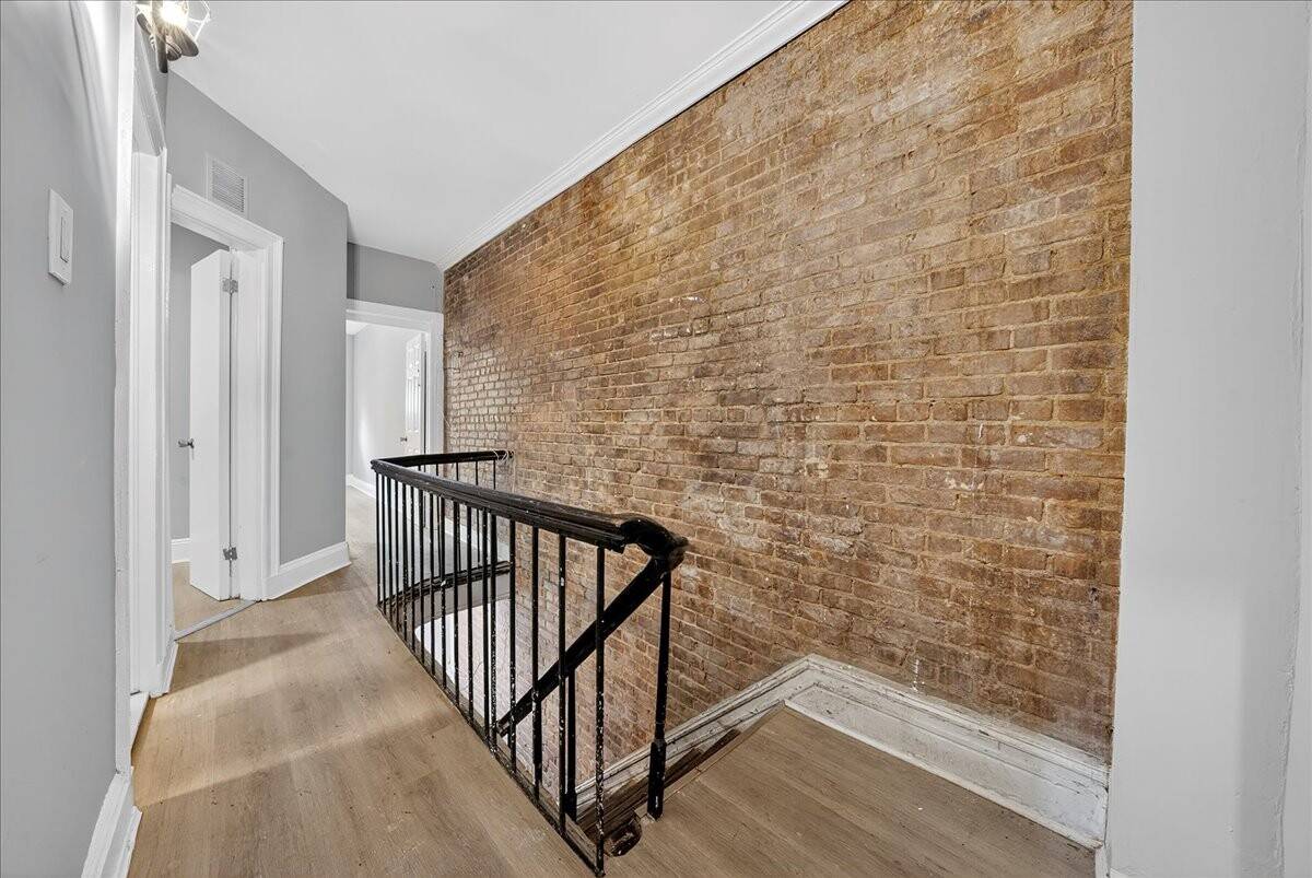 Mott Haven Find ! Brick semi attached two family home in Mott Haven is ready for your vision rich with character and history.