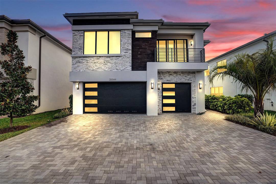 Honolulu model home where modern design meets everyday comfort in Boca Raton s premier gated community, Lotus Palm.