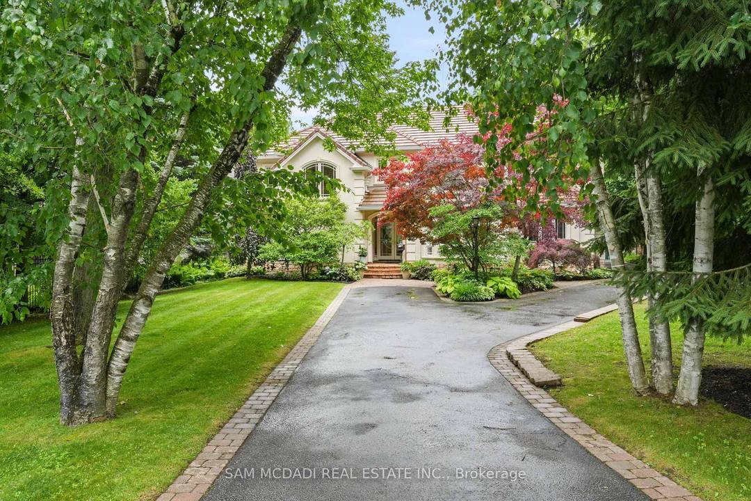 Immerse yourself in the upscale rhythm of Lorne Park, where this remarkable custom built estate delivers privacy and comfort.