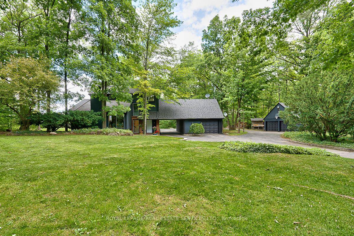 ESCAPE TO YOUR OWN PRIVATE OASIS ON ALMOST FOUR ACRES IN MILTON !