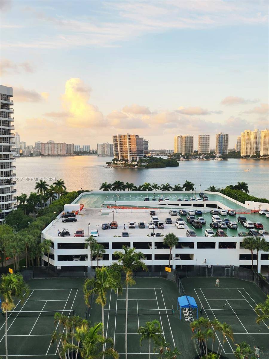 Mystic Pointe Unit 1201 Spectacular residence located on the 12th floor featuring breathtaking panoramic views of the water and city skyline, offering spacious interiors, a functional layout, and abundant natural ...