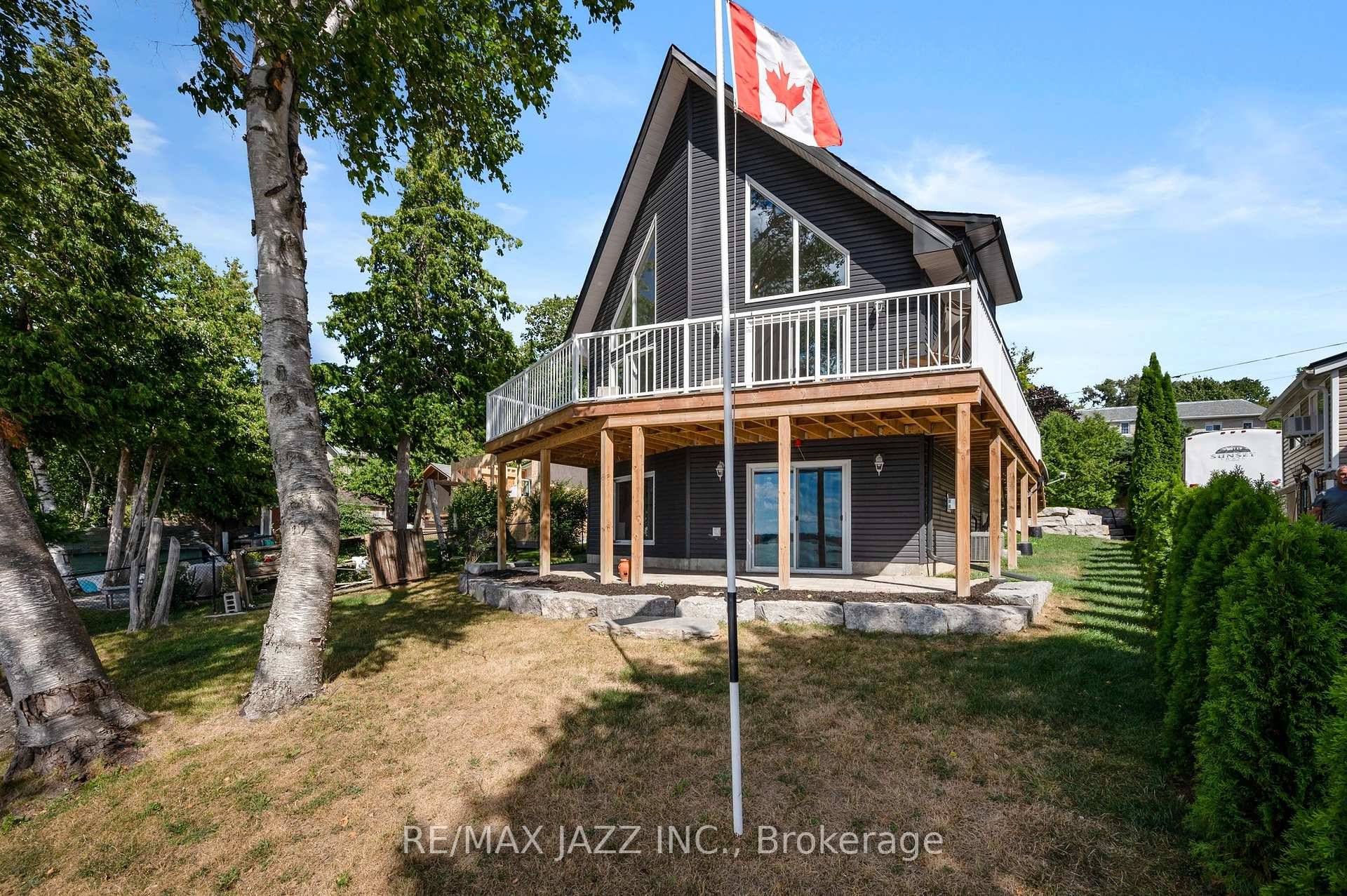 Where Luxury Meets Lake Life at Your One Of a Kind Custom Built 5 Year Old Waterfront Home with Mesmerizing Views of the Lake for Miles.