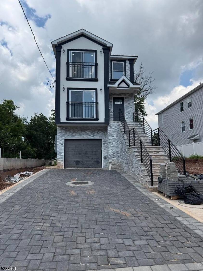 Brand new construction 2 family with first unit having 3 bedrooms and 3 full bathrooms.