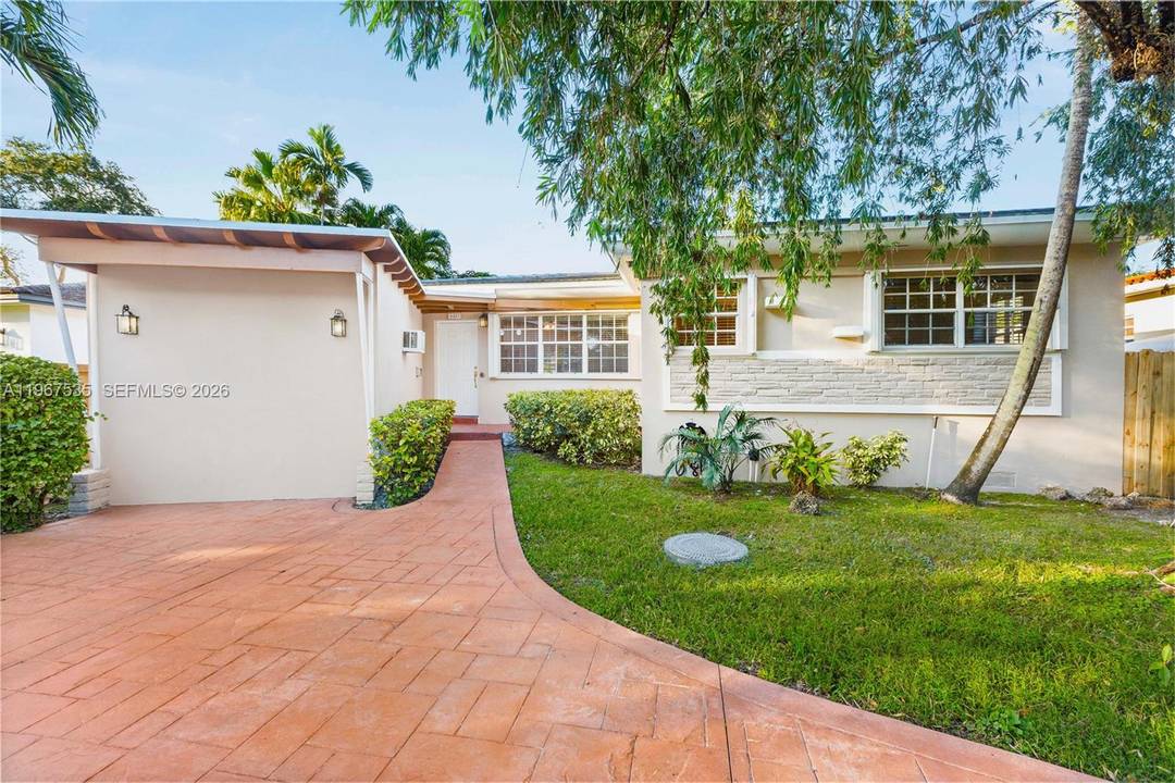 Tucked in Little Gables just one block from Coral Gables, this beautifully home pairs classic charm with modern peace of mind.