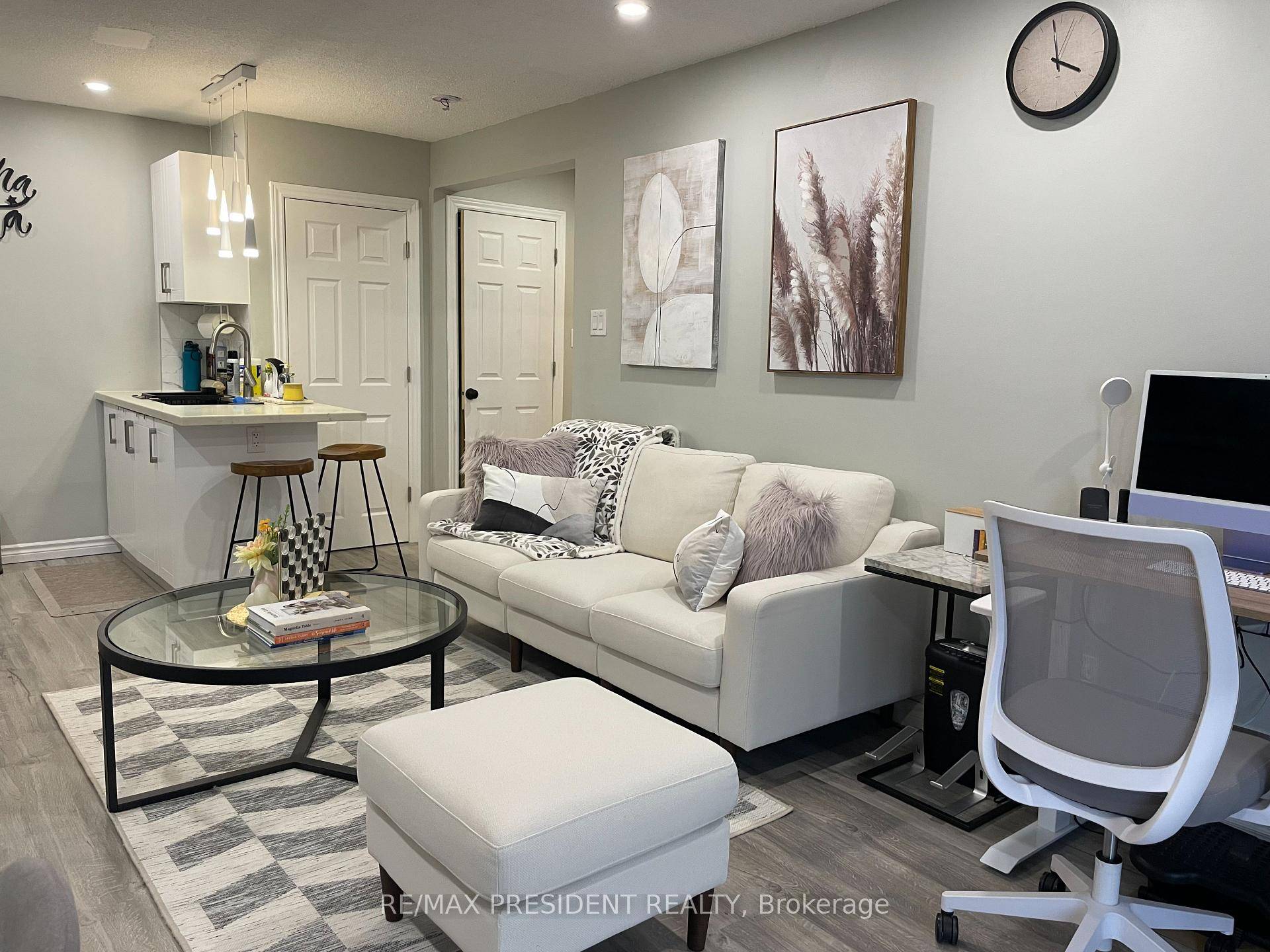 Welcome to your beautifully renovated and fully furnished main level rear unit !