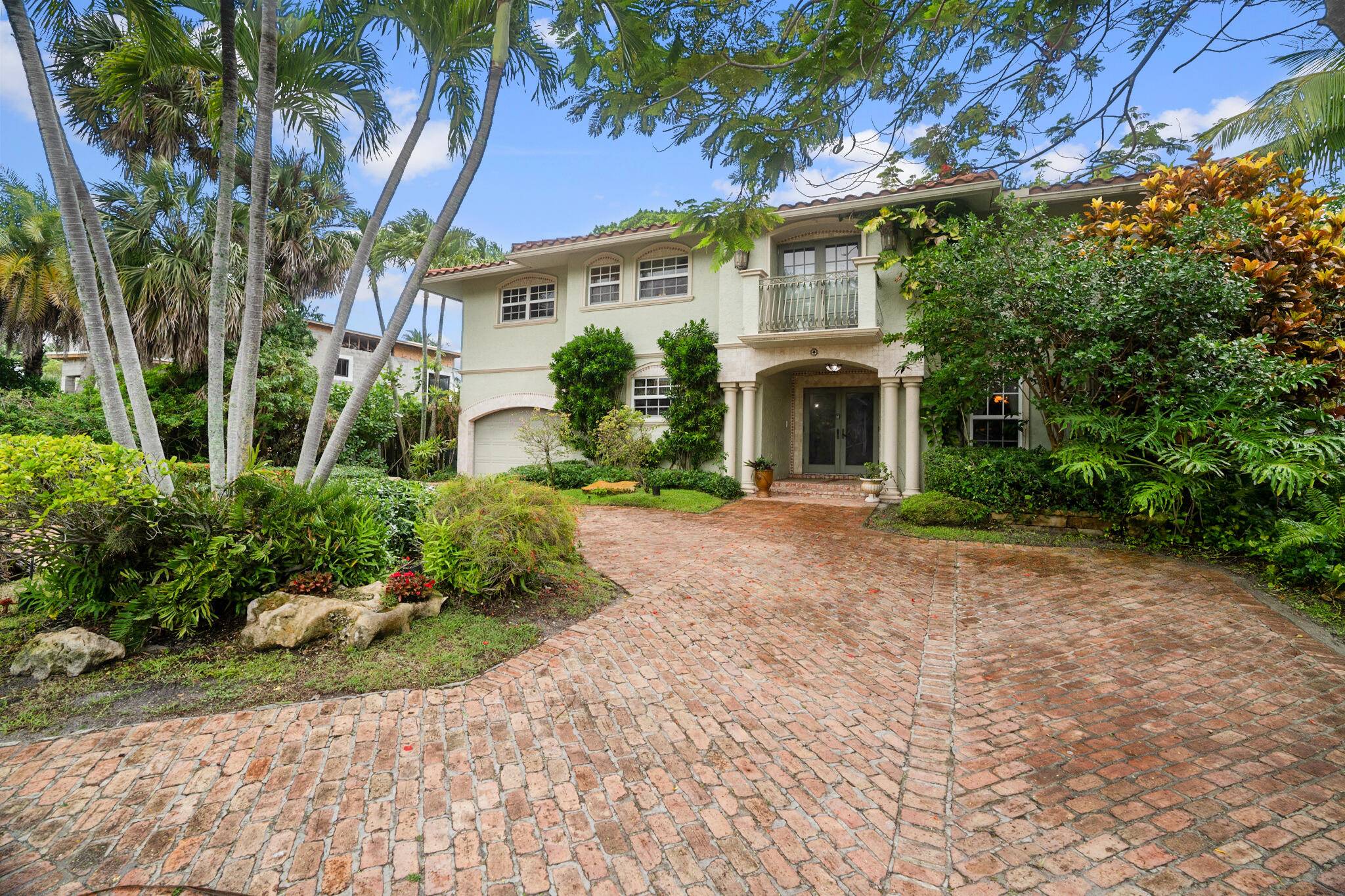 Exquisite Waterfront Estate with Private Dock in The Historic Old Floresta Area.