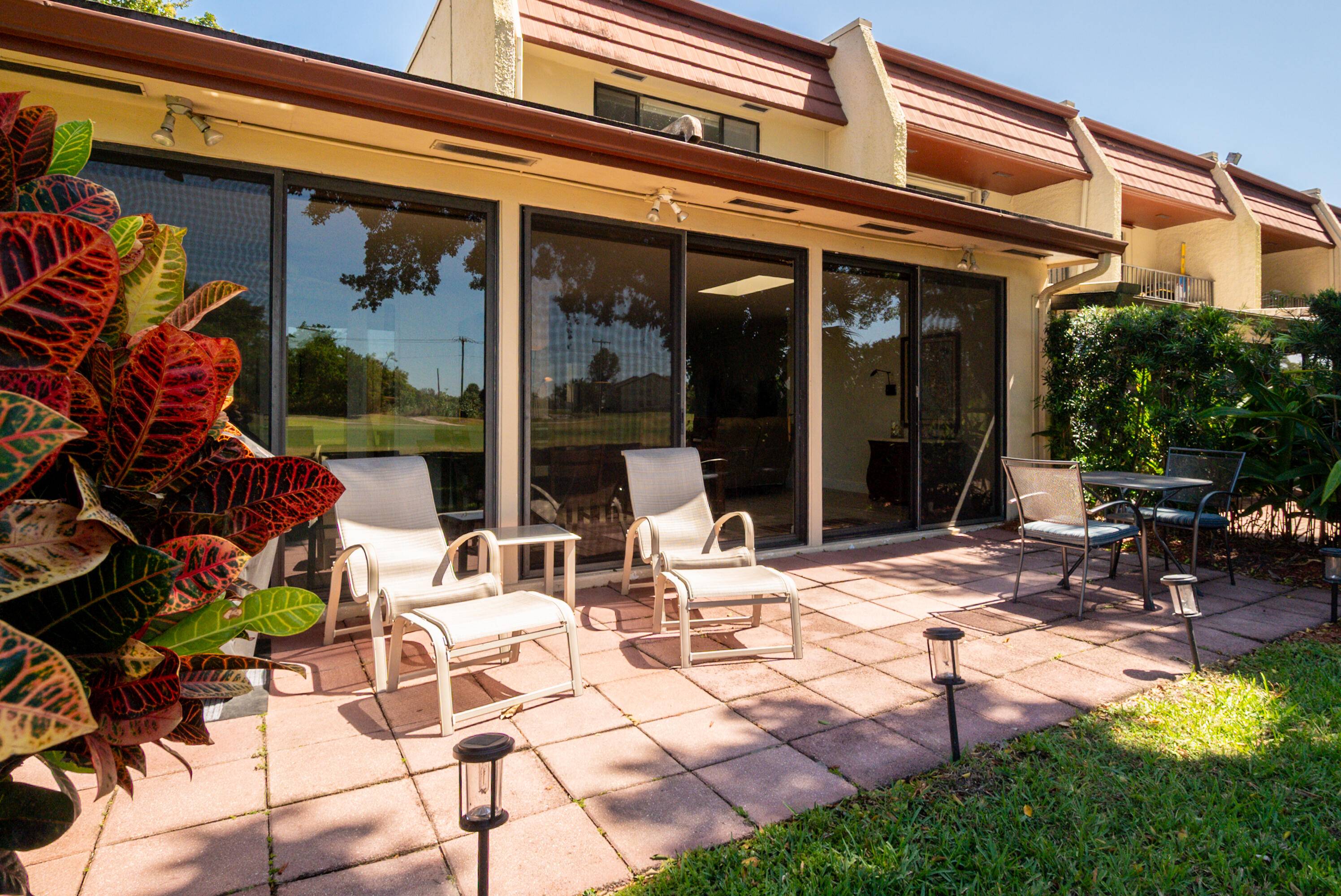 Uniquely reconfigured corner unit with 330 sq ft of additional air conditioned space featuring all impact windows and pull down shades.