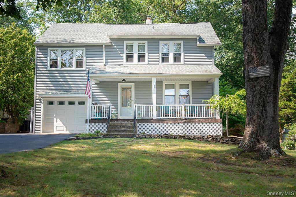 Charming and Versatile Colonial home with Duplex Zoning Currently used as a Single Family home, however can be easily converted back to two separate dwellings.