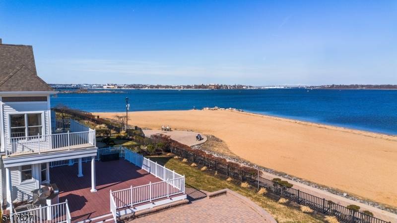 Experience refined coastal living in coveted Lighthouse Bay !