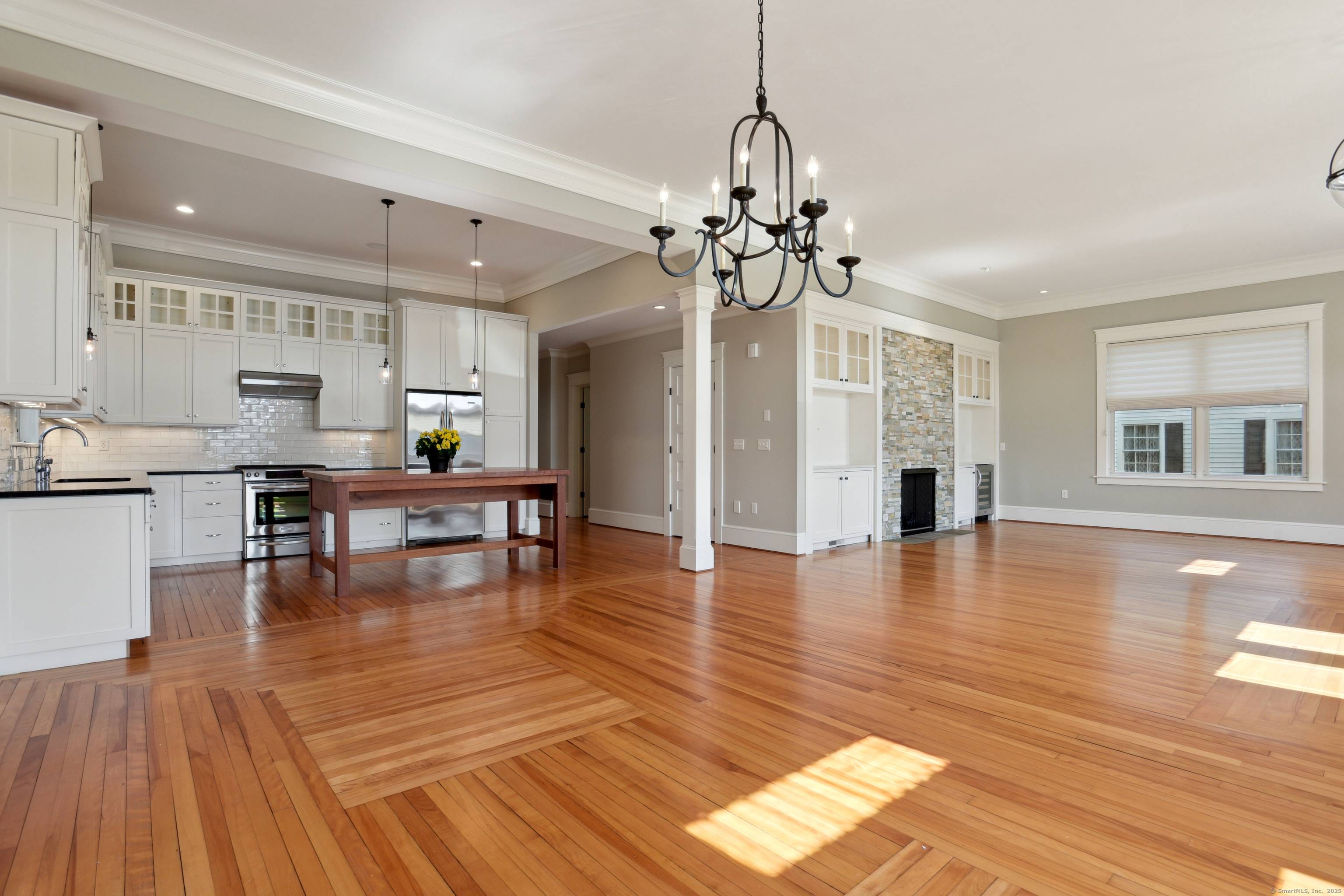 Discover unparalleled one level living in this stunning 2, 338 square foot condominium in Historic Downtown Mystic, Connecticut across from the Mystic River and Bascule Bridge.