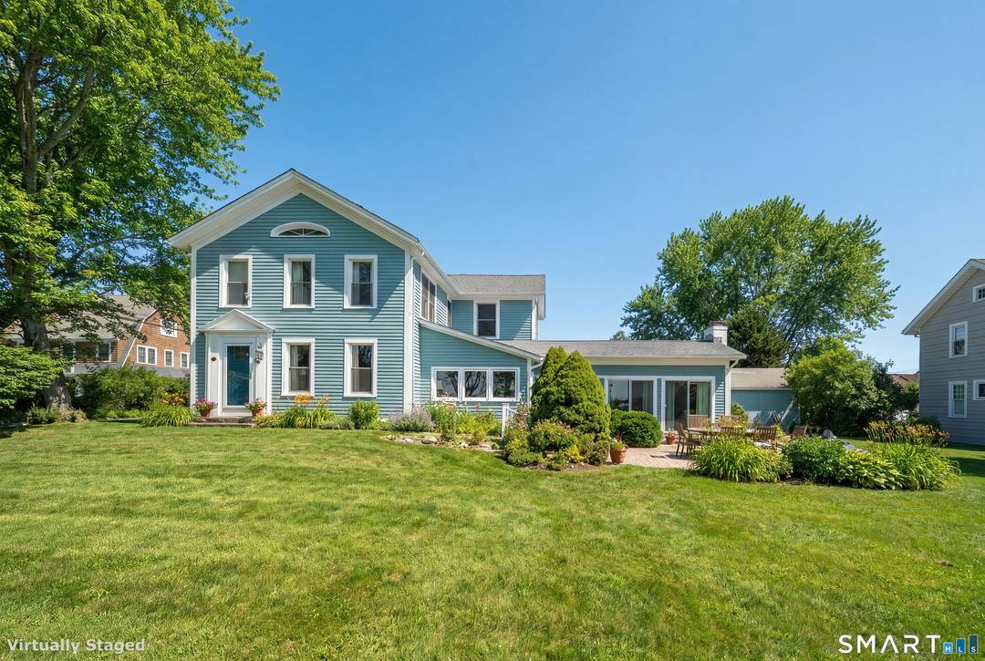 Set along the coveted shoreline of Madison, this pristine coastal retreat seamlessly blends timeless antique charm, the finest modern conveniences and extensive Long Island Sound views.