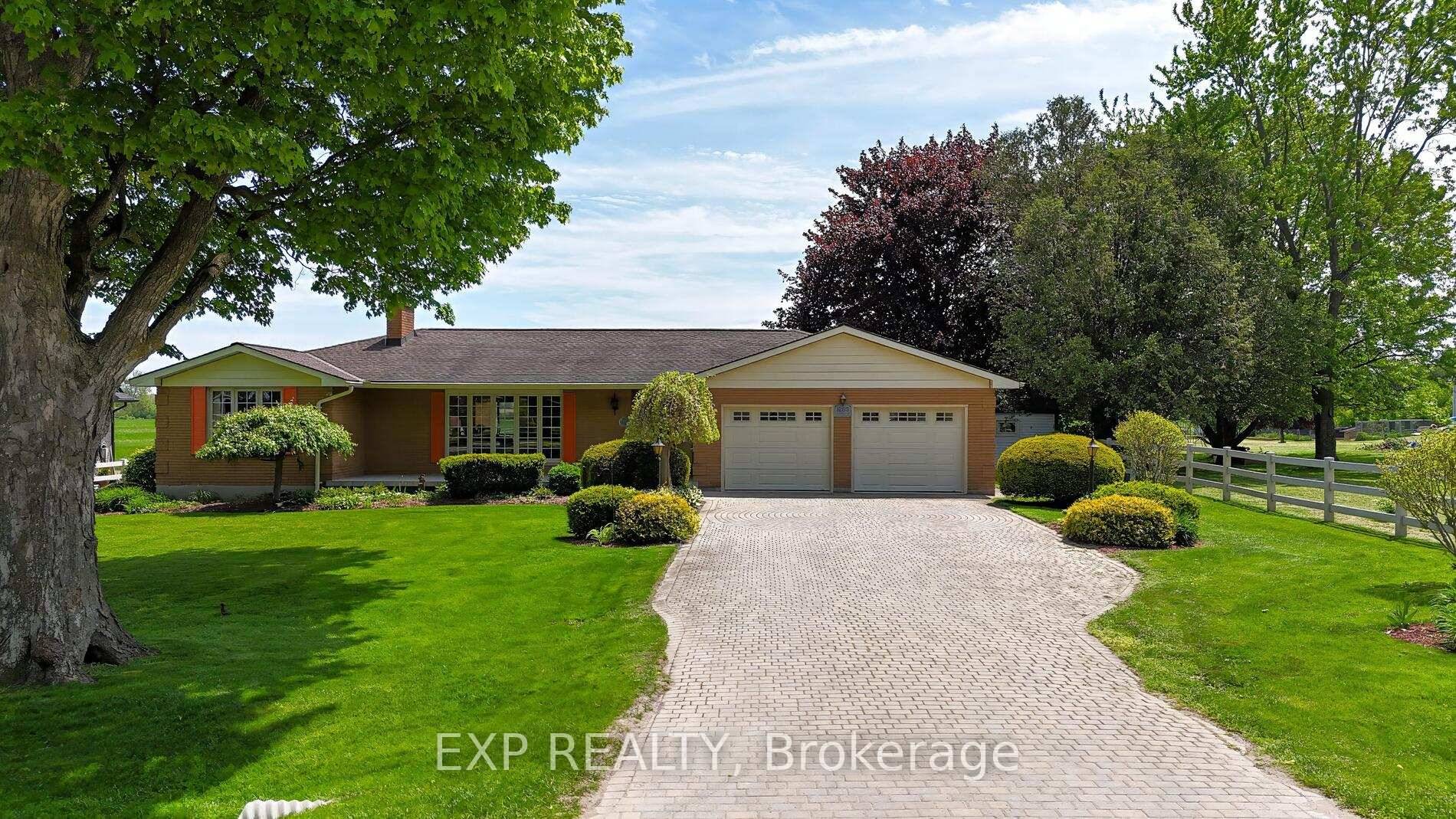 Nestled on a picturesque country lot with unobstructed views of rolling fields, this beautifully maintained residence offers the perfect blend of refined comfort and rural charm.