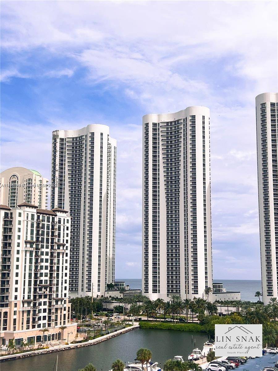 A corner high floor with a vast balcony and beautiful views of the canal, city, and ocean.