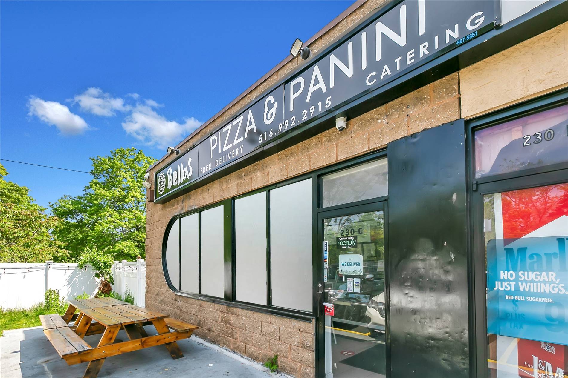 Perfect Pizza Shop Restaurant in a shopping center in Oceanside, next to by businesses near by.