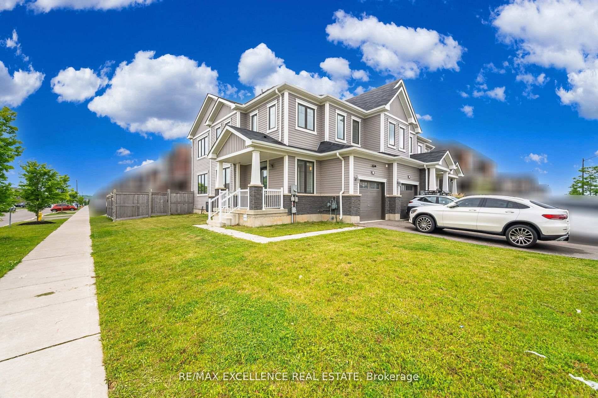 Welcome to 53 Oaktree Drive a stunning, upgraded FREEHOLD END UNIT corner townhome on a premium oversized lot with NO SIDEWALK !