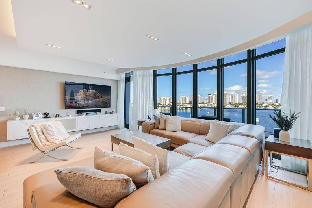 NO EXPENSE SPARED IN THIS SENSATIONAL, DESIGNER FINISHED DUPLEX VILLA IN THE COVETED 11 STACK AT 5 STAR MARINA PALMS YACHT CLUB !