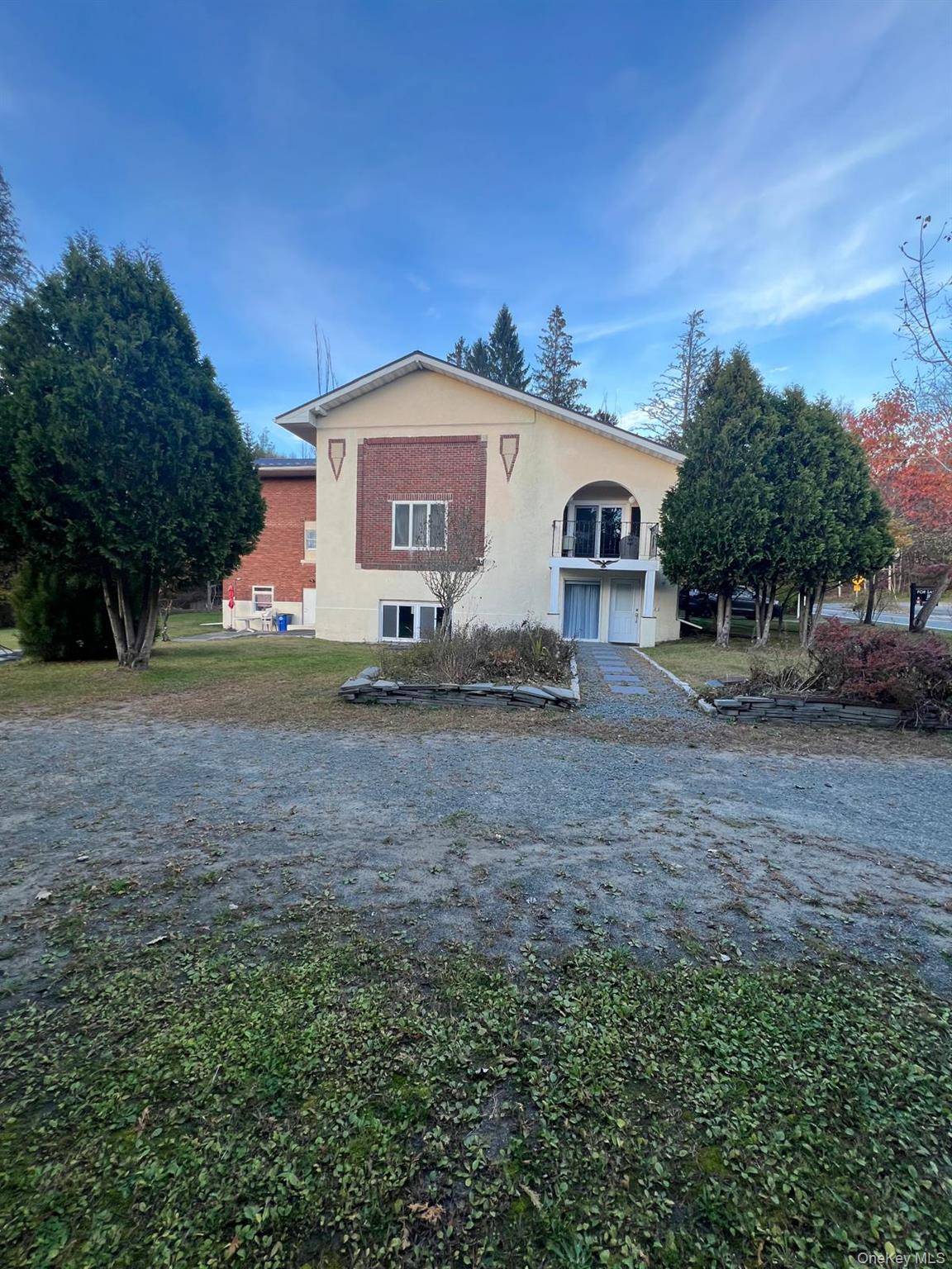 Welcome to this spacious 4, 600 sq ft multi family property set on a full acre of land along the picturesque Little Beaverkill Brook, a serene natural stream that runs ...