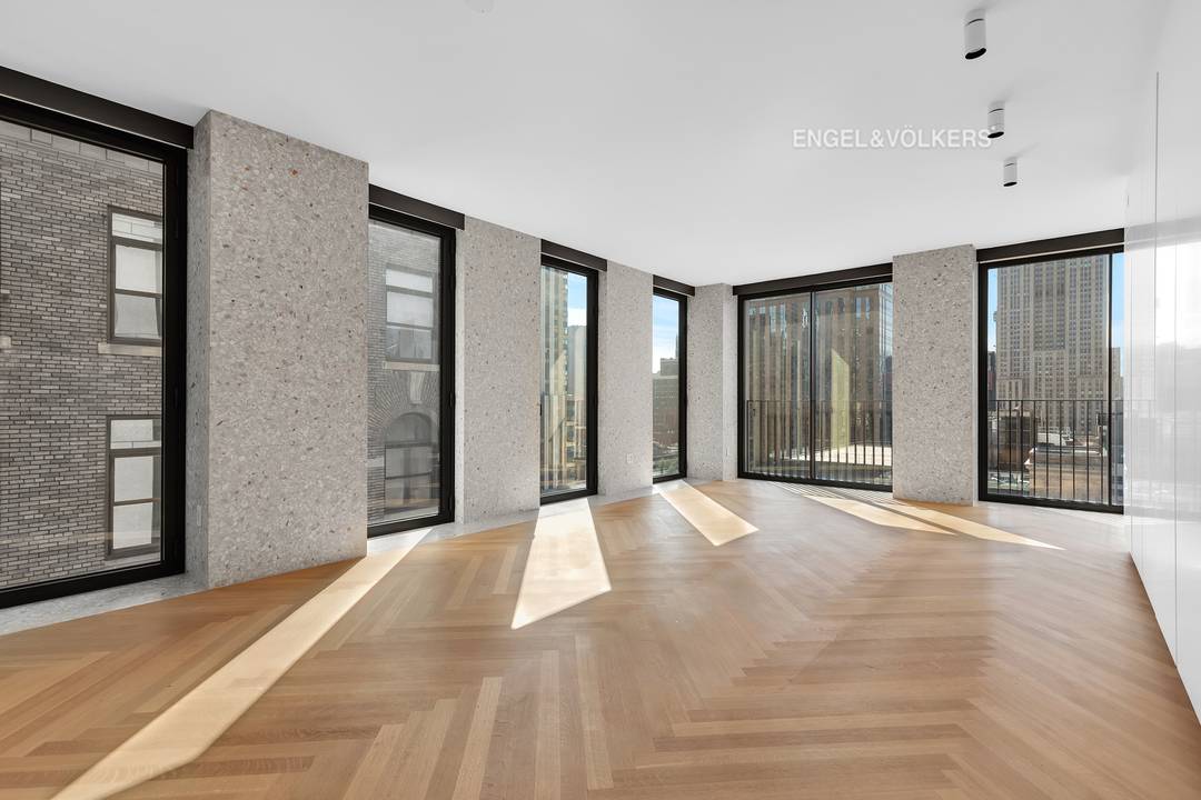 Enjoy open city and Empire State Building views through sliding Vitrocsa glass doors with Juliet balconies in this corner one bedroom residence at The Bryant.