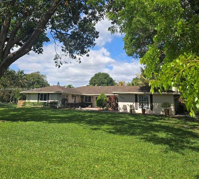 Coming Soon listing ! This elegant four bedroom, three bath home sits on over an acre and offers comfort and style.