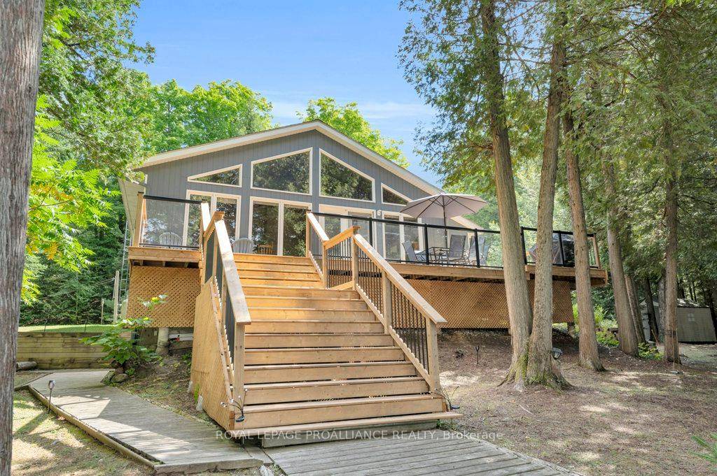 Discover this charming year round waterfront home on Clear Lake, offering 3 bedrooms, 2 bathrooms, 180 feet of west facing shoreline for breathtaking sunsets, and 1.