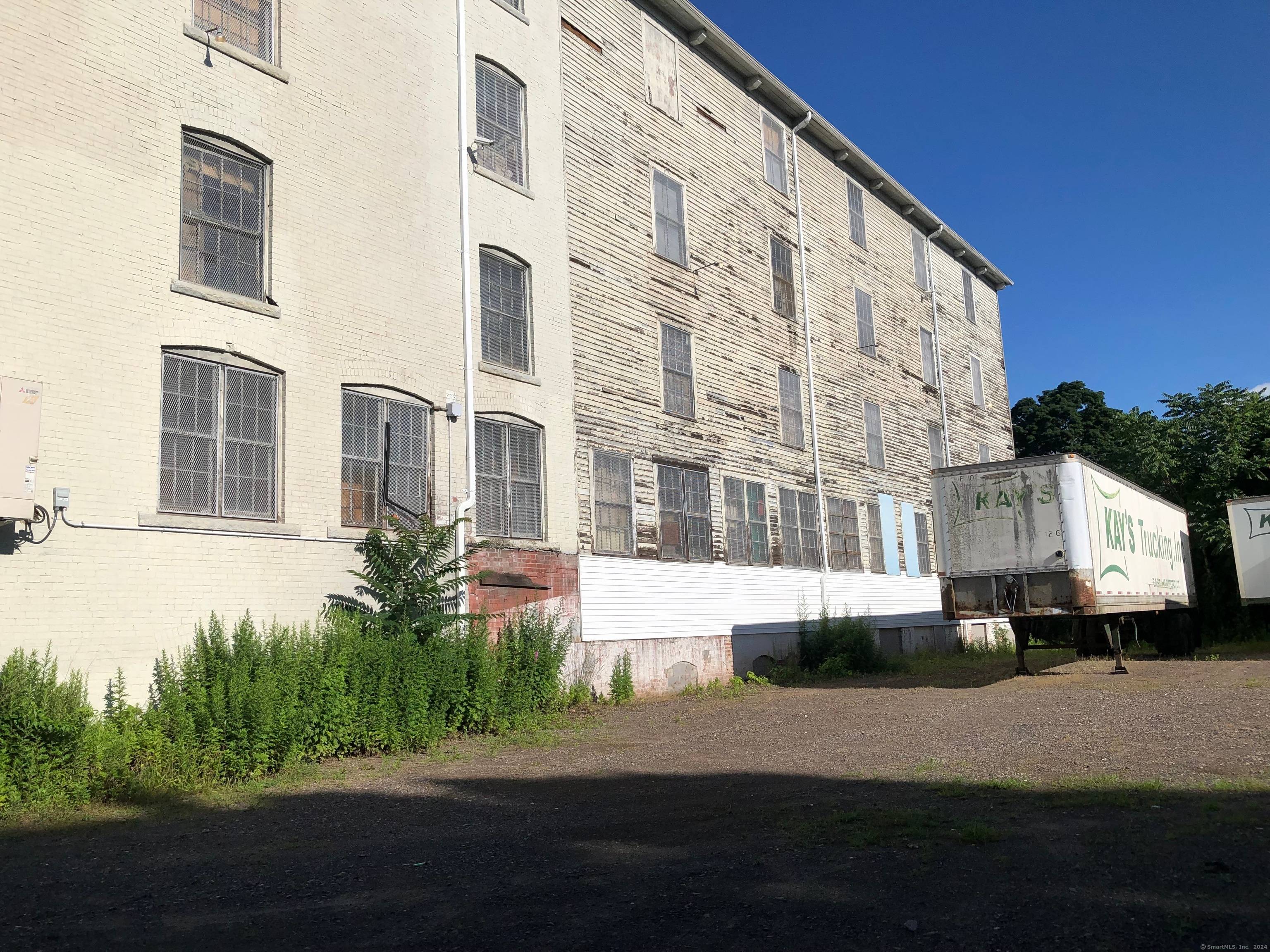 BACK ON THE MARKET. This property consists of 2 commercial buildings and one 72x100 building lot.