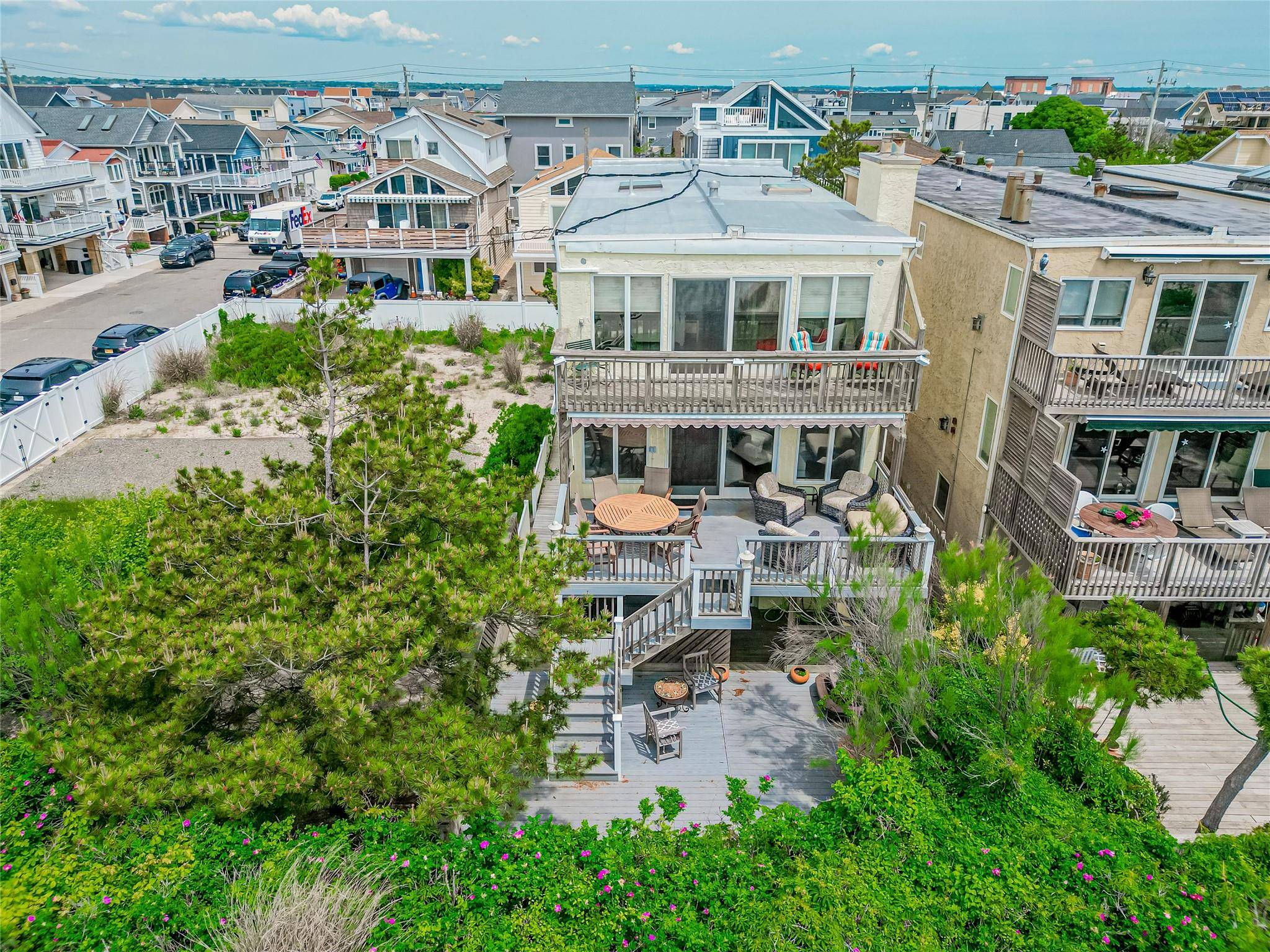 This stunning oceanfront retreat is perfectly positioned on the Atlantic, offering panoramic water views from private decks on all three levels including a beachfront deck, a main level terrace, and ...