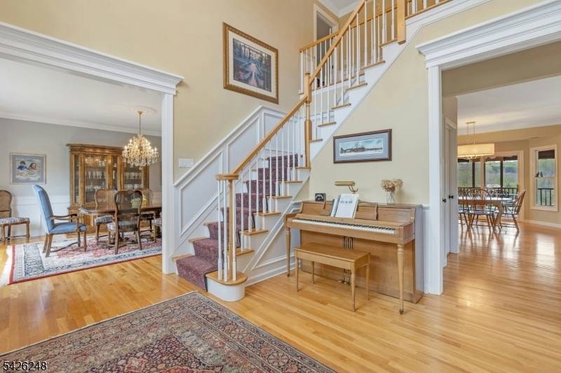 This beautiful home offers approximately 5 acres of lush, landscaped property, offering ample space and a peaceful, scenic setting.