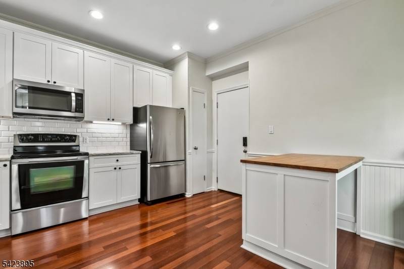 This charming townhome offers two spacious bedrooms and two and a half baths, providing both privacy and comfort.