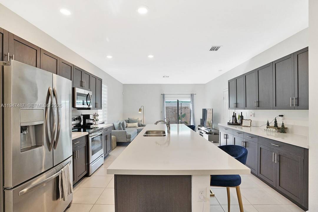 Welcome home to the crown jewel of The Edge on 15th the largest most desirable corner townhouse in this gated Edgewood community, ideally located just minutes from Hollywood Fort Lauderdale ...