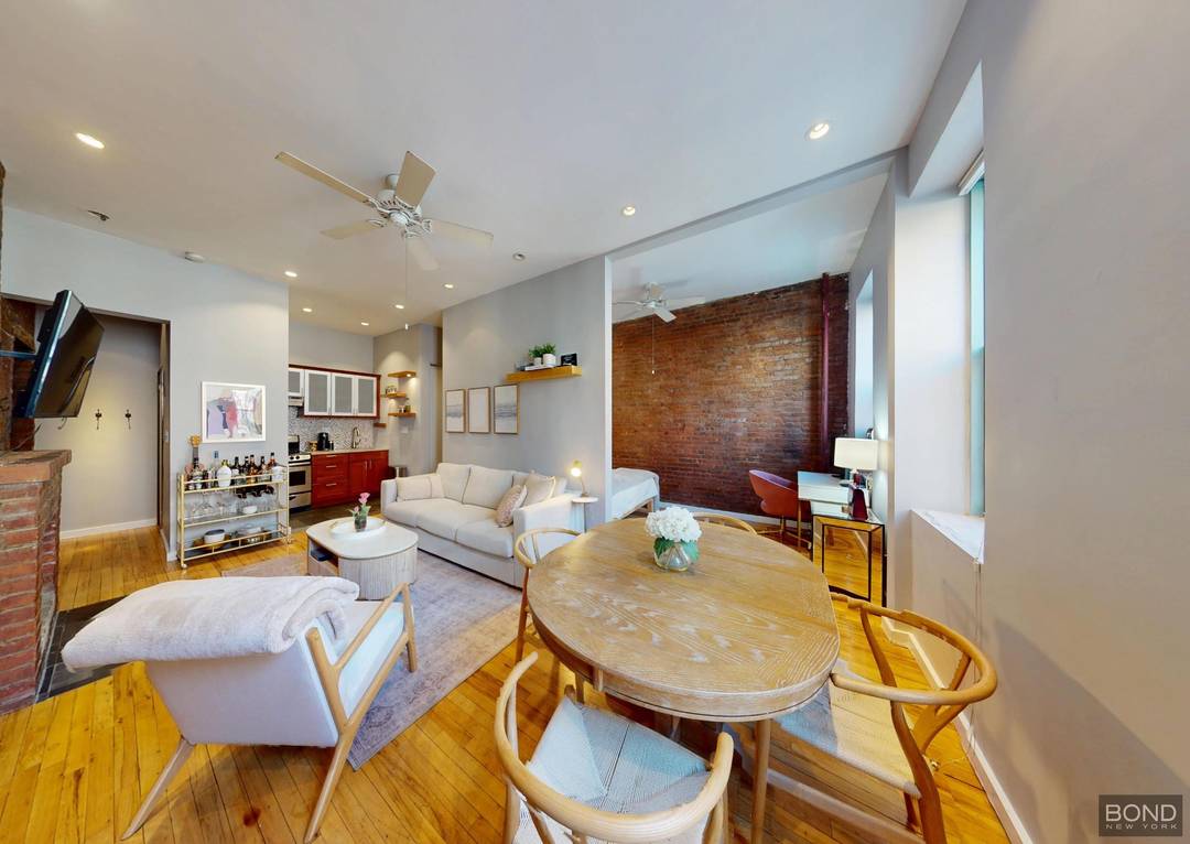 Its one flight up to these expansive living quarters defined by lofty 10 foot ceilings, recessed lighting, and oversized parlor floor windows that bathe the home in natural light.