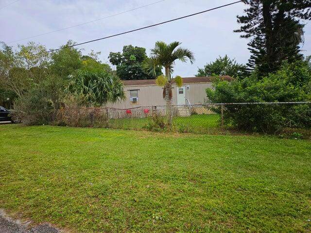 Big corner lot with 2 1 mobile home and huge storage shed.