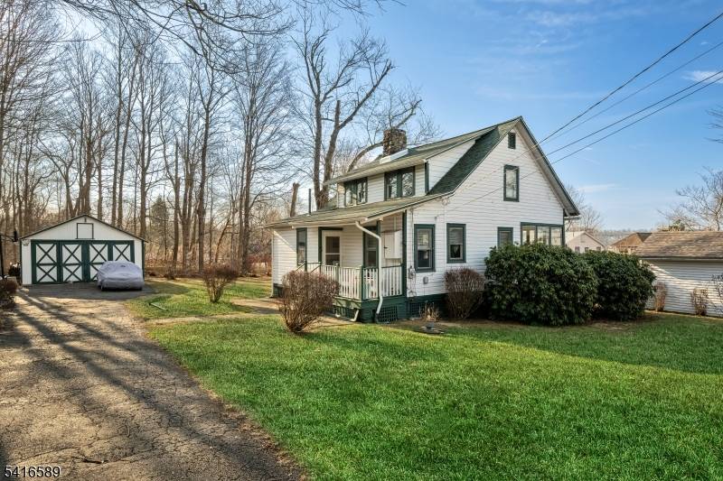 Welcome to this Charming Lakehouse Retreat nestled on a rare double level lot with deeded lake rights, private beach area, and breathtaking views of Budd Lake New Jersey's largest natural ...