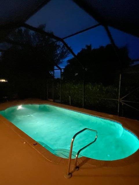 Discover this beautifully maintained 3 2 Pool home on a corner lot, in the desirable guard gated community of Andros Isle, offering resort style amenities.