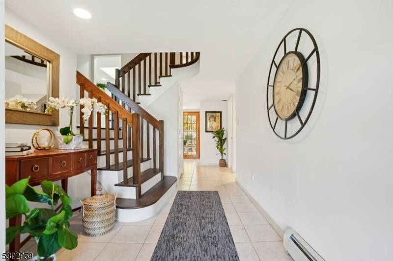 Nestled on a perfectly flat lushly Landscaped corner lot.