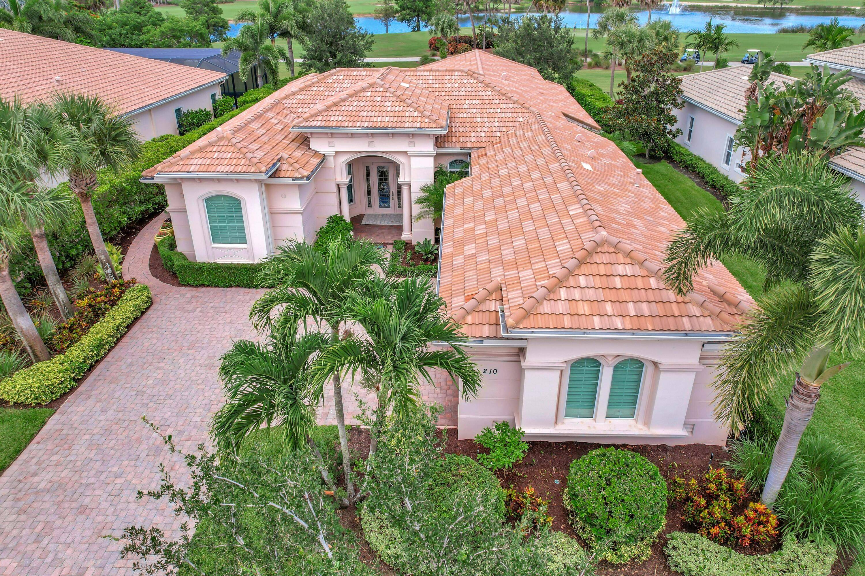 Welcome home to this immaculate 4 bedroom, 4 Bath, one story expanded Castania model in the prestigious Jupiter Country Club.