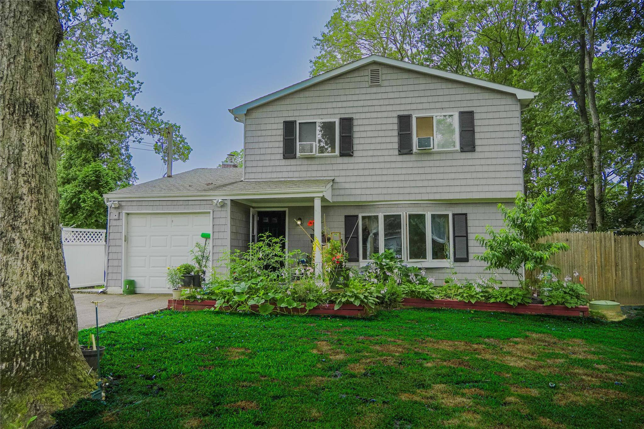 welcome to this generously sized 5 bedroom, 2 full bathroom home located in the heart of Mastic !