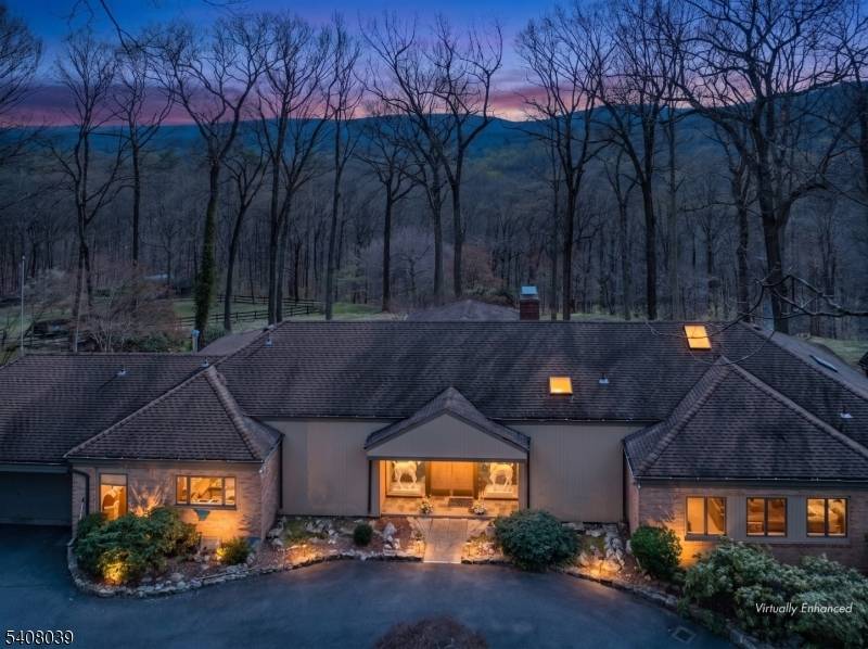 Extraordinary custom home with stunning long countryside views to the south.