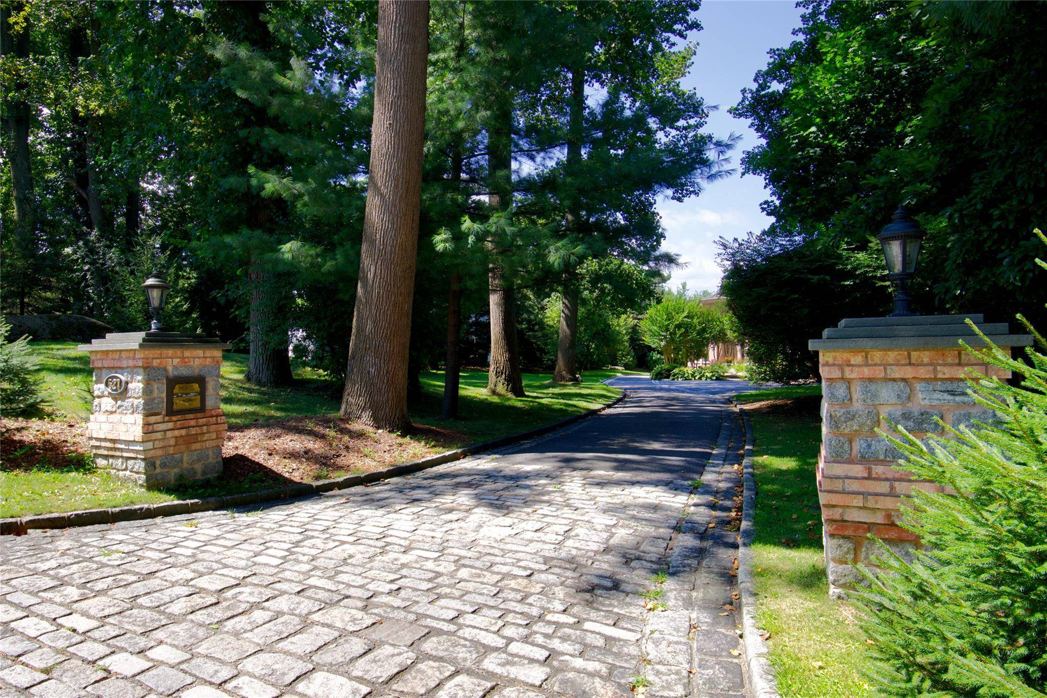 Nestled in the coveted Village of Flower Hill, a stately 2002 built European inspired Contemporary Brick estate effortlessly blends timeless elegance with modern sophistication.