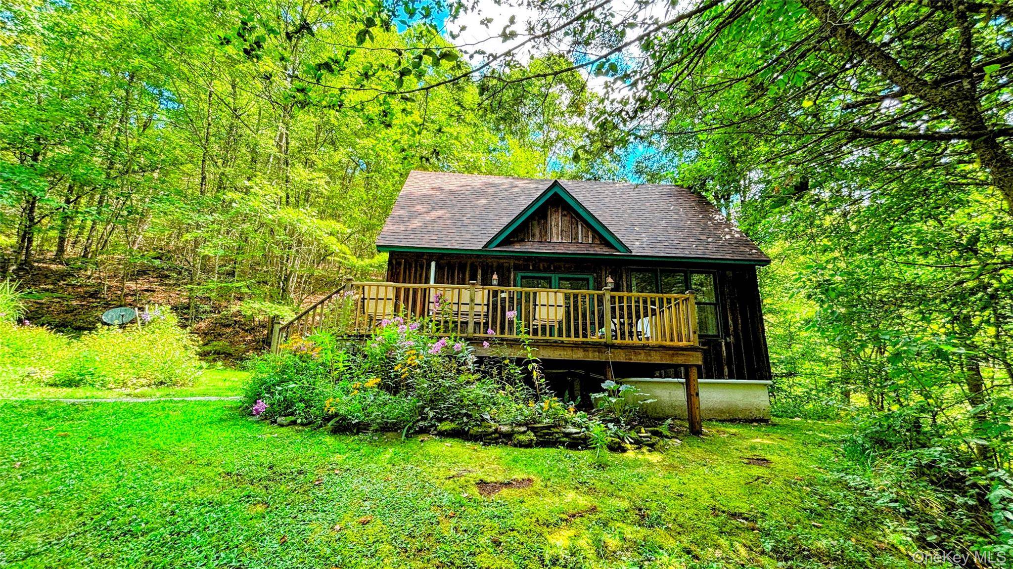 This charming cape cod on a sprawling 19 acres of breathtaking nature.