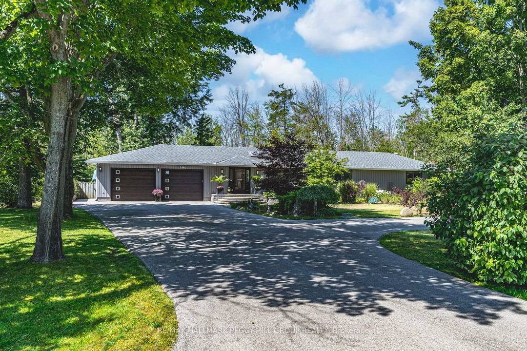 RARE ESTATE BUNGALOW NEAR LAKE SIMCOE ON JUST UNDER HALF AN ACRE WITH OVERSIZED GARAGE, 2, 100 SQ FT, MODERN UPDATES amp ; WALKING DISTANCE TO TWO BEACHES !