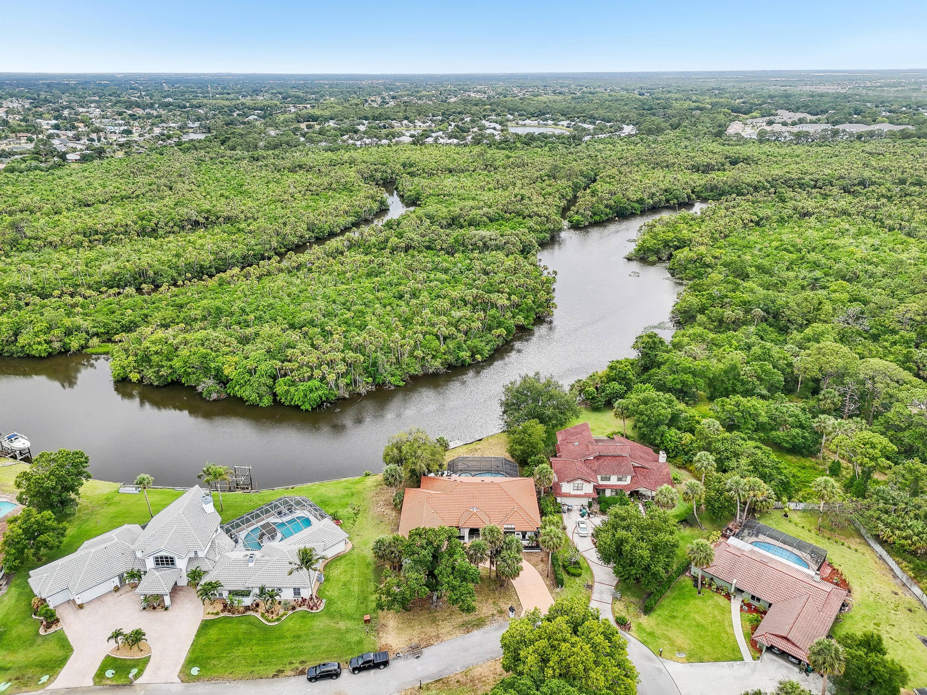 Immerse yourself in the enchanting allure of Florida coastal living with this stunning waterfront property, ideally situated along the tranquil river.
